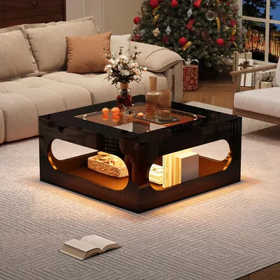 A living room scene with a couch, Christmas tree, and a coffee table.