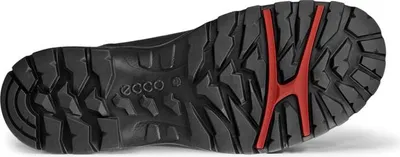 The sole of a black boot with a red accent.