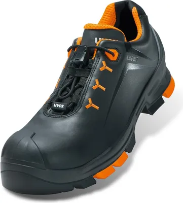 A single black and orange safety shoe is shown against a white background.