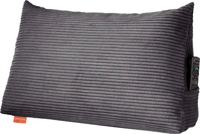 A dark gray corduroy backrest pillow with a side pocket containing a remote control.