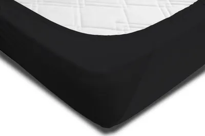 A close-up view of a black fitted sheet on a white mattress.