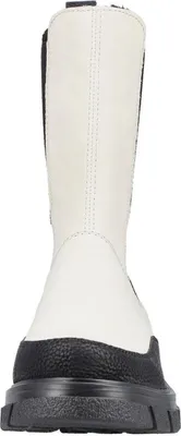 A front view of a beige and black Chelsea boot with a thick black sole.