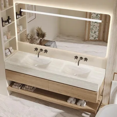 A modern bathroom vanity with a double sink and a large LED mirror.