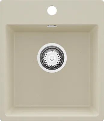 A top-down view of a beige granite kitchen sink with a drain assembly in the center and a hole for a faucet above it.