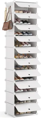 A tall, white plastic shoe rack with multiple shelves, each with a door. A brown handbag and some items are hanging on the side.