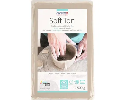 A package of soft clay with hands working on a pottery piece.