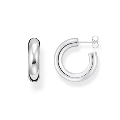 A pair of silver hoop earrings is displayed against a white background.