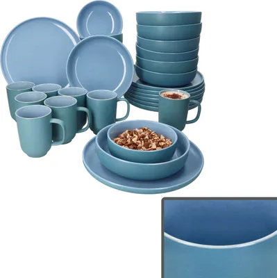 A collection of blue ceramic dinnerware, including plates, bowls, and mugs, arranged on a white background.