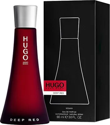 A bottle of Hugo Boss Deep Red perfume and its packaging are displayed against a black background.