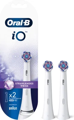 A package of Oral-B iO toothbrush heads, with two heads displayed outside the packaging.