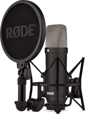 A studio shot of a microphone with a pop filter and shock mount.
