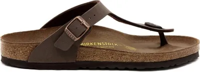 A side view of a single brown Birkenstock flip-flop sandal.