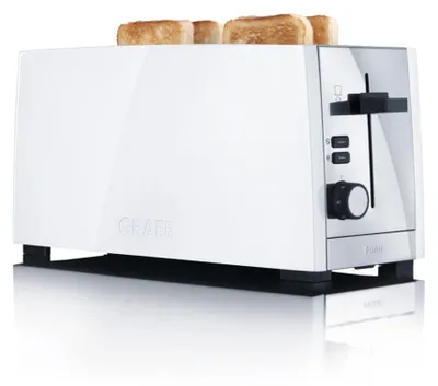 A white Graef toaster with two slices of toast in it, shown from a low angle on a reflective surface.