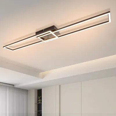 A modern rectangular ceiling light fixture with integrated LED lighting is mounted on a white ceiling.