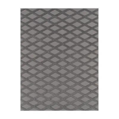 A close-up view of a gray rug with a diamond pattern.