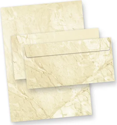 A stack of stationery with a marble pattern, including letter paper and envelopes, on a white background.