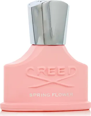 A studio shot of a pink Creed Spring Flower Eau de Parfum bottle with a silver cap.