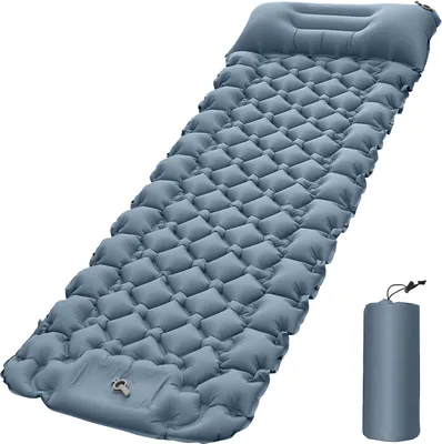 A blue inflatable sleeping pad is shown against a white background, with a smaller rolled-up version of the pad to the right.