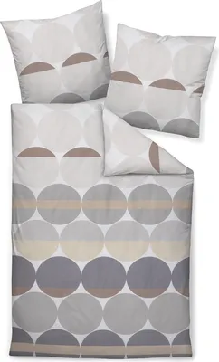 A set of bedding, including a duvet cover and pillowcases, laid out flat.