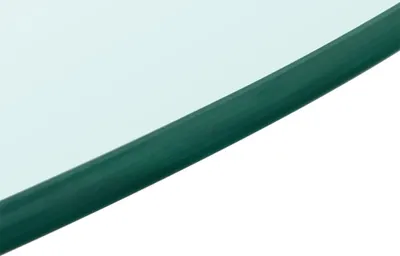 A close-up view of the edge of a round glass tabletop with a green edge.
