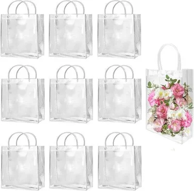 Immagine prodotto di Sacchetti regalo in plastica trasparente - Con manici - 10 pezzi - Riutilizzabili - 23 cm x 17 cm x 7 cm - Per matrimoni, compleanni, Halloween, negozi, boutique, sacchetti per dolciumi