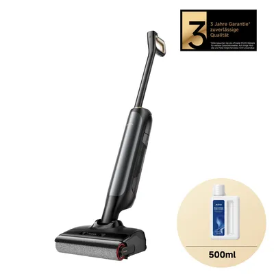 A black and gray wet and dry vacuum cleaner is shown on a white background, with a bottle of cleaning fluid and a warranty badge in the corner.
