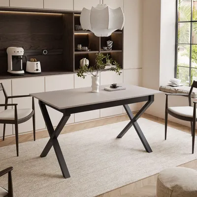 A dining room setting with a table and chairs.