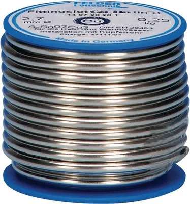 A spool of solder wire on a blue base.