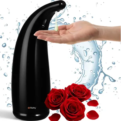 A black automatic soap dispenser is shown dispensing soap into a person's hand, with water splashes and red roses in the foreground.