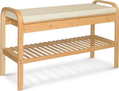A shoe rack with a bench and a cushion.