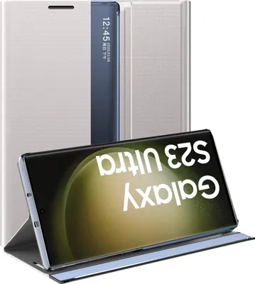 A silver flip case for a Samsung Galaxy S23 Ultra phone is shown, with the phone displaying its screen.