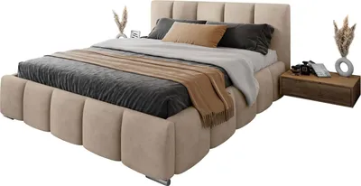 A bed with bedding and a nightstand.