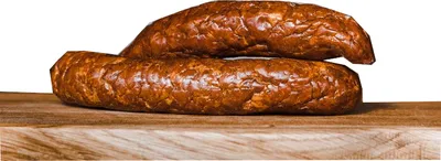 Two sausages are stacked on a wooden board against a white background.