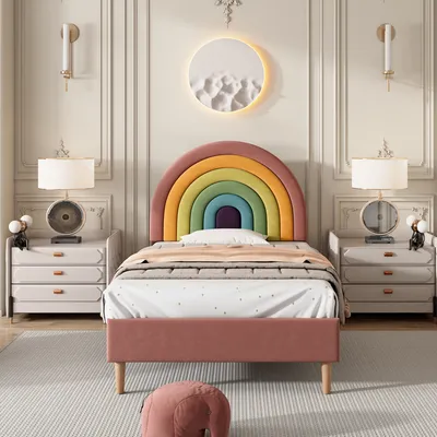 A child's bedroom with a rainbow-themed bed.