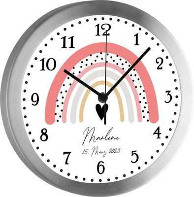 A close-up view of a decorative wall clock with a rainbow design and text.