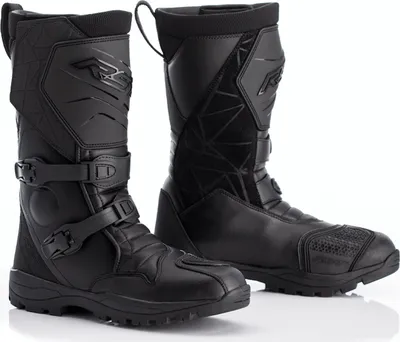 A pair of black motorcycle boots on a white background.