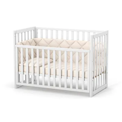 A white baby crib with beige bedding, shown from a slight angle on a white background.
