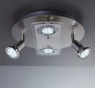 A ceiling light fixture with multiple LED spotlights.
