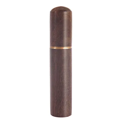 A dark brown wooden needle case with a gold band around the top.