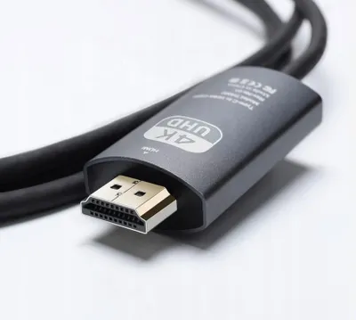 Close-up of an HDMI adapter cable with a 4K UHD logo.