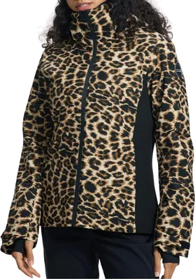 A woman wearing a leopard print ski jacket.