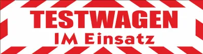 Produktbild von INDIGOS UG - Magnetschild "Testwagen im Einsatz" mit Rahmen 30 x 8 cm rot- Magnetfolie für Auto / LKW / Truck / Baustelle / Firma