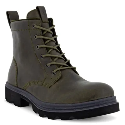 A single green boot is shown against a white background.