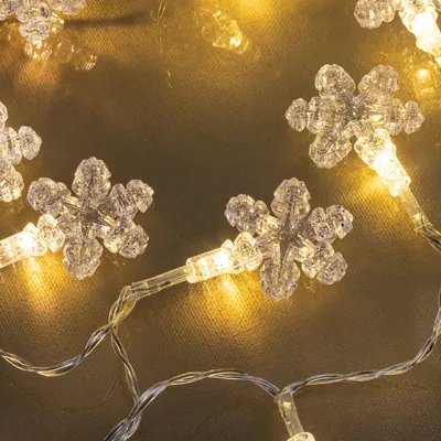 Immagine prodotto di Catena luminosa a LED BJÄLLRA 20 LED bianco caldo fiocco di neve