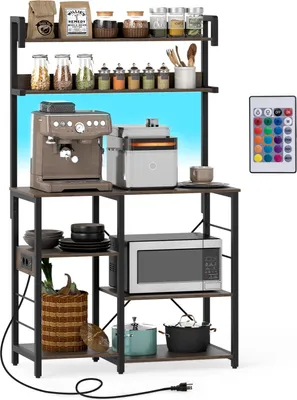A kitchen shelf unit with various appliances and kitchenware displayed on it.