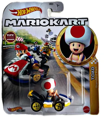 A Hot Wheels Mario Kart Toad toy car in its packaging, with a background illustration of a race.