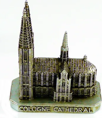 A miniature model of Cologne Cathedral on a light blue base.