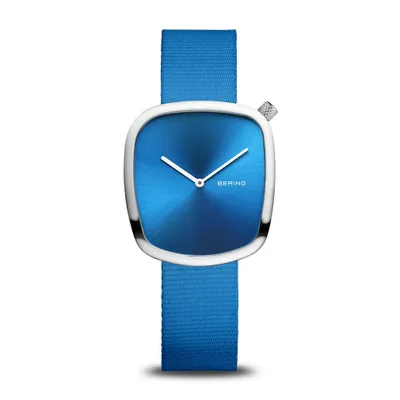 A watch with a blue dial and a blue fabric strap, presented on a white background.