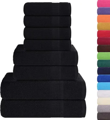 A stack of black towels next to a column of colorful towels.