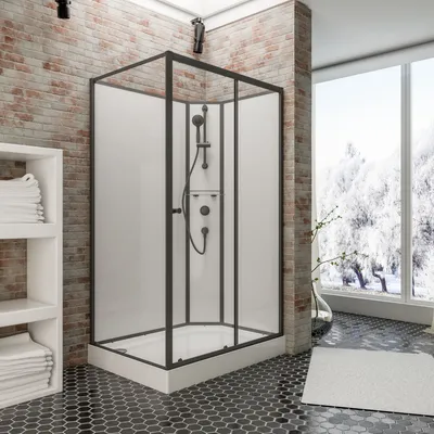A modern bathroom with a shower cabin, brick wall, and a large window overlooking a snowy landscape.